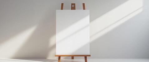 A white easel with a blank canvas on it photo