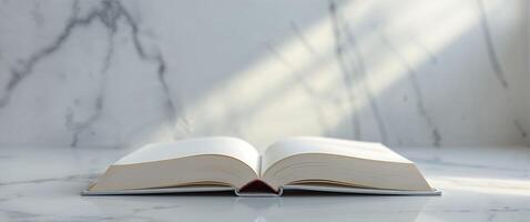 Open book with blank pages on marble surface displaying content. photo