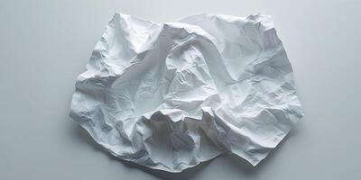 White crumpled paper with textured wrinkles and creases on a blank background photo