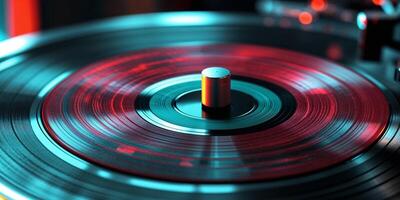 Close Up of a Spinning Red and Teal Vinyl Record on a Turntable. photo
