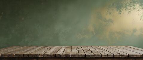 An empty table in front of a green wall photo