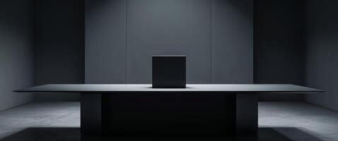 A black table with a square object on top photo