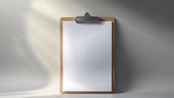 A clipboard with a blank piece of paper on it photo