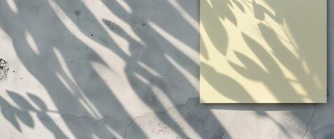 Pastel Yellow Paper Mockup with Leaf Shadows on Concrete Wall photo