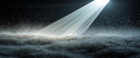 Stunning beam of light illuminating dust particles in dark space creating a mesmerizing visual effect. photo