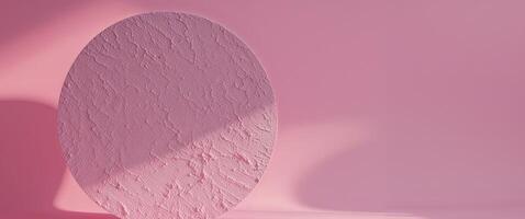 Round textured surface on pink background for abstract design and modern presentation. photo