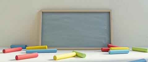 A chalkboard with colorful crayons and a chalkboard photo