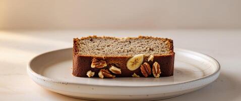 A slice of banana bread on a plate photo