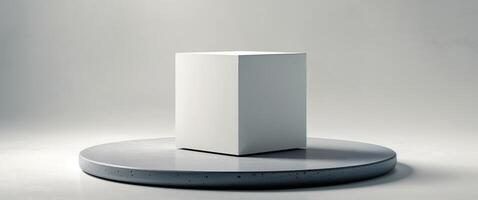 Simple cube resting on a circular stone platform. photo