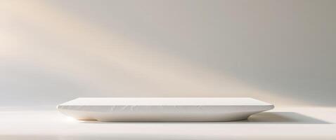 Clean white stone slab with a matte finish and gentle light reflections. photo