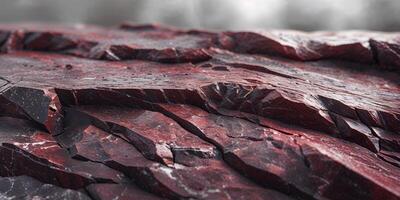 Dark red granite rock texture displays rough surface background. photo