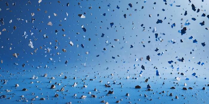 Abstract blue surface with scattered particles creating a textured effect photo