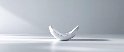 A white vase with a curved shape on a white surface photo