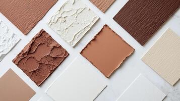 Colorful collection of paint swatches on textured background with flowers photo