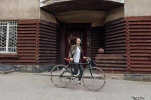 Enjoying a retro bicycle ride in stylish tweed clothing in a charming British setting photo
