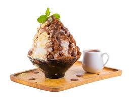 Korean shaved ice dessert with sweet toppings, Red tea Bingsoo or Bingsu isolated on a white background. photo