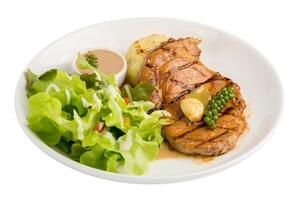 Black pepper pork steak isolated on a white background. photo