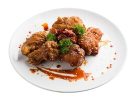 Spicy Deep Fried Breaded Chicken Wings isolated on a white background. photo