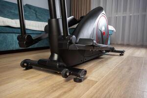 Modern Elliptical Trainer in the Room at Home. Concept of Exercising at Home, fitness photo