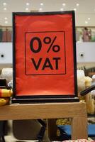 Sign promoting 0 percent VAT on products in a retail store photo