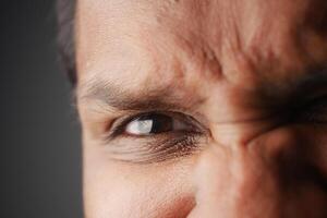 Expressions of intensity captured in a close-up portrait of a man photo