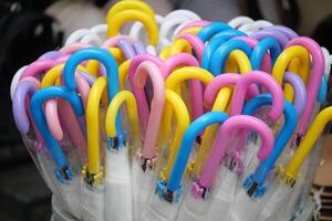 Colorful umbrellas arranged in a striking display for sale photo