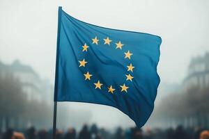 Flag of the European Union waving in the wind on the background of a crowd of people photo