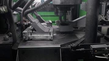 Automated machine pressing diamond discs during manufacturing process in factory, High-precision equipment with hydraulic system ensures uniform shape and material density video