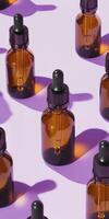 High fidelity flat lay of amber medical glass bottles on lilac background for design concepts photo