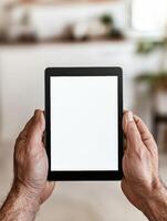 Male hands holding blank tablet screen for app presentation or digital content display photo