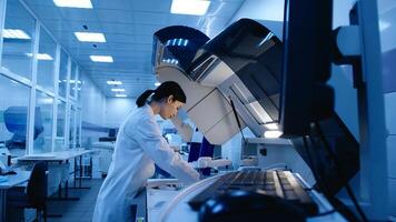 Medical Science Laboratory. Portrait of Beautiful European Scientist Does Analysis of Test Sample. Ambitious Young Biotechnology Specialist, working with Advanced Equipment photo