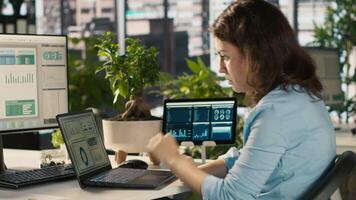 Employee at office desk getting upset after noticing mistake while editing documents, typing on keyboard. Overworked woman distraught by error committed while inputting data on laptop, camera A video