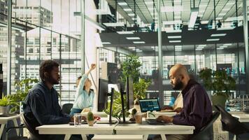 Arab man in office reviewing financial graphs, analyzing key performance indicators. Middle Eastern employee in workspace looking over data trends and strategic insights, camera B video