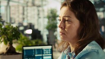 Stressed employee at office desk feeling tired while editing documents on computer. Overworked woman exhausted after inputting data in workplace at PC all day, feeling fatigue, camera B video