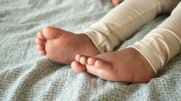 Relaxing moment with bare feet resting on a soft blanket video