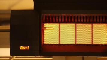 Heating element in use displays warm glow and timer countdown video