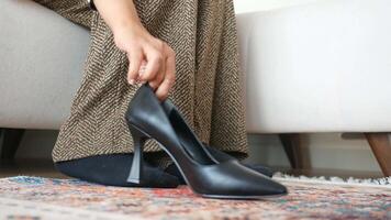 Trying on stylish high heels while relaxing at home video