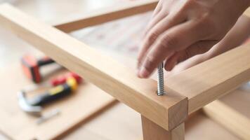 Home furniture assembly with simple tools at workshop table video