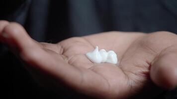 Moisturizing cream application on hand for daily skincare routine video