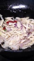 Slicing fresh ingredients for a flavorful stir fry in the kitchen video