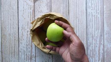 top view of hand pick mango from a packet video