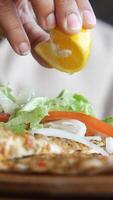 Fresh lemon adds flavor to healthy meal preparation with veggies video