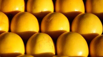 Fresh lemons arranged in a vibrant display at a local market video