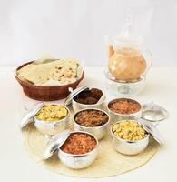 Traditional Middle Eastern Breakfast with Flatbread, Falafel, Assorted Dishes, and Karak Tea in Elegant Setup top view photo