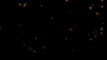 Loop orange bokeh particles animation flow on black abstract background video