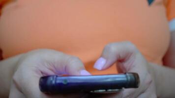 Closeup of hands typing on smartphone, touchscreen interaction in motion video