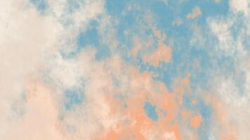 A dreamy sky with a soft blend of blue, white, and peach clouds. The colors create a serene and ethereal atmosphere, evoking a peaceful natural scene perfect for a calming background. video