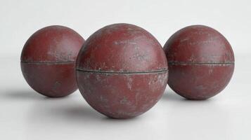 Three Rustic Red Spheres on White Background, A Study in Texture and Form photo