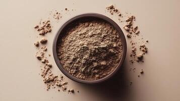 Aromatic Brown Powder in a Wooden Bowl, A Close-Up View photo