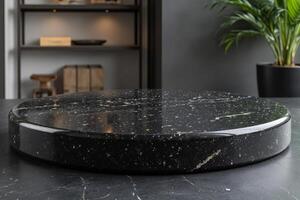A black marble podium with gold accents, set against a blurred background of shelves and a plant photo